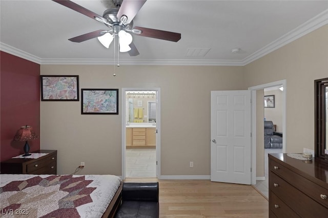 bedroom featuring ensuite bathroom, baseboards, crown molding, and light wood-style floors