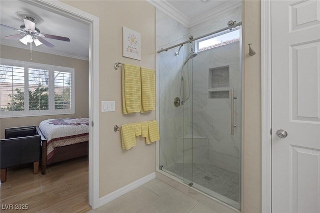 bathroom with a marble finish shower, crown molding, and a ceiling fan