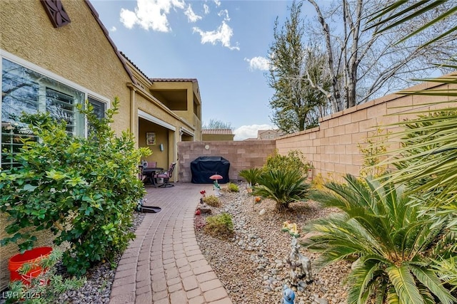 view of yard with fence and a patio area