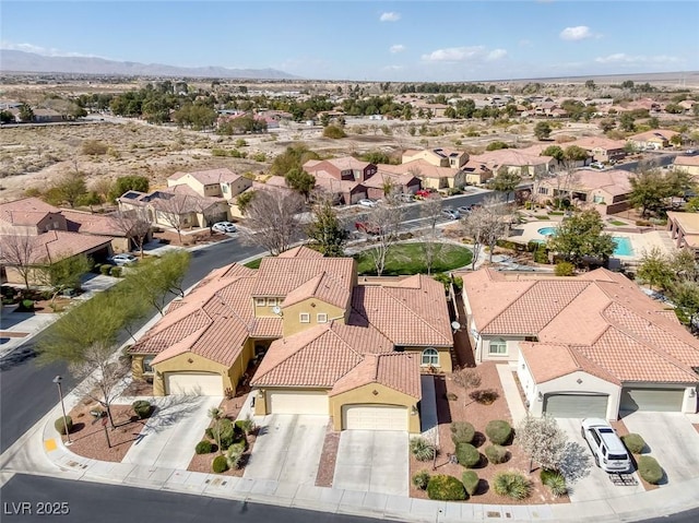 drone / aerial view with a mountain view and a residential view