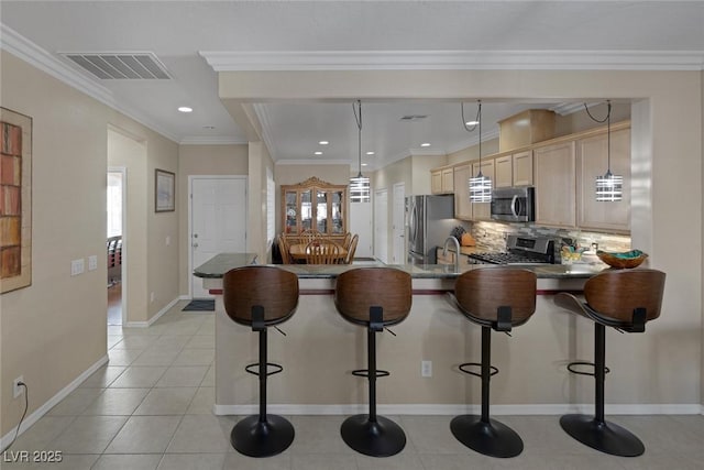 kitchen featuring stainless steel appliances, dark countertops, visible vents, and crown molding