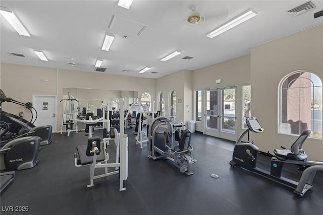 workout area with visible vents and french doors