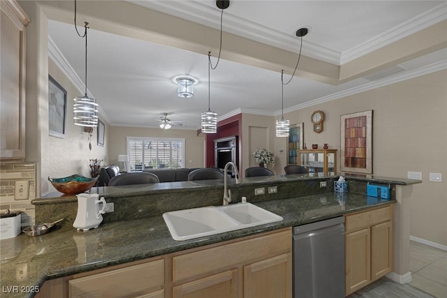 kitchen with stainless steel dishwasher, ornamental molding, light brown cabinets, and a sink