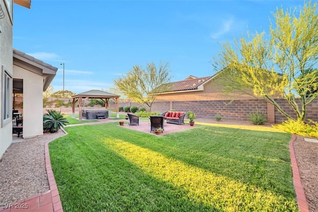 view of yard featuring outdoor lounge area, a hot tub, a gazebo, a patio area, and a fenced backyard