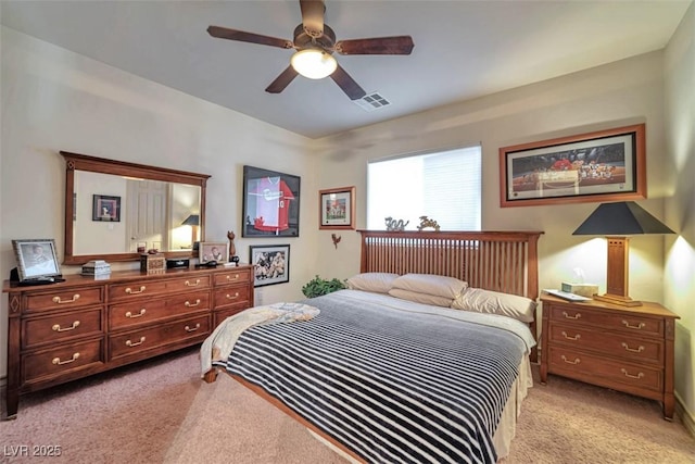 bedroom featuring light carpet, ceiling fan, and visible vents