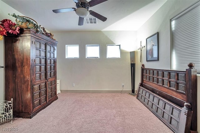 spare room featuring a ceiling fan, carpet, visible vents, and baseboards