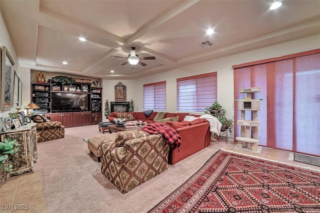 living room with visible vents, coffered ceiling, a ceiling fan, a fireplace, and recessed lighting