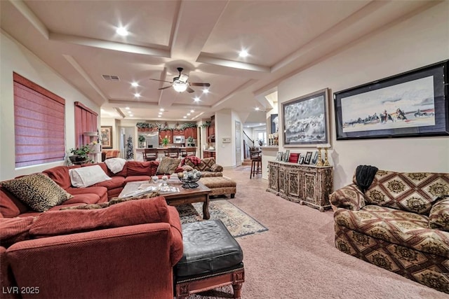 carpeted living room with coffered ceiling, recessed lighting, visible vents, and a ceiling fan