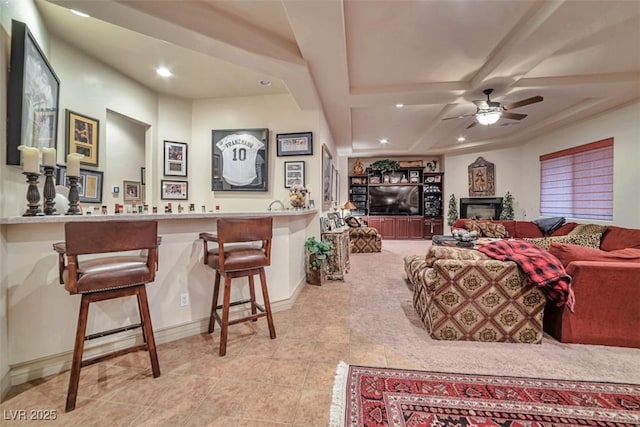 living room with a fireplace, a dry bar, recessed lighting, ceiling fan, and tile patterned flooring