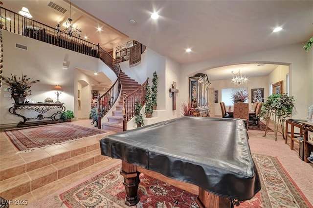 playroom featuring an inviting chandelier, visible vents, arched walkways, and recessed lighting