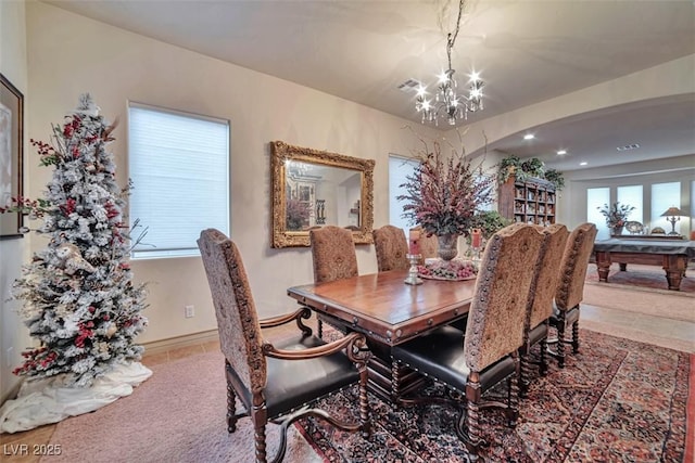 dining space featuring visible vents, a chandelier, a wealth of natural light, and recessed lighting