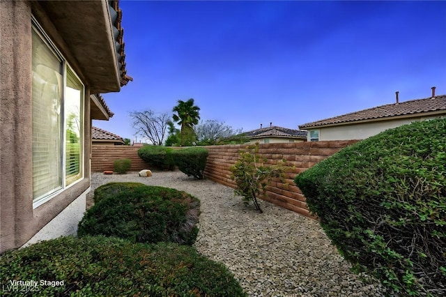 view of yard with a fenced backyard