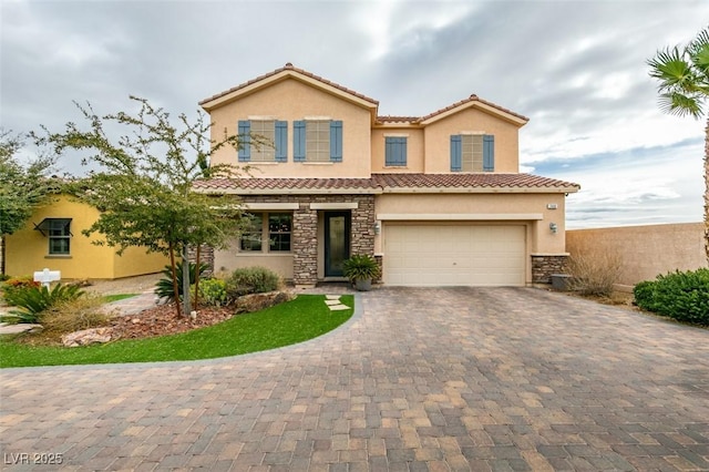 view of front of property with a garage, a tiled roof, stone siding, decorative driveway, and stucco siding