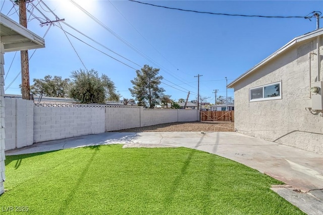 view of yard featuring a patio and a fenced backyard