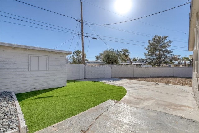 view of yard featuring a patio area and a fenced backyard