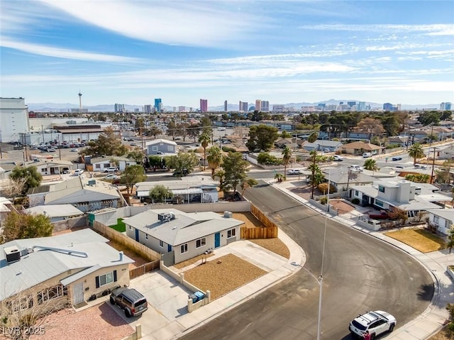 birds eye view of property featuring a city view