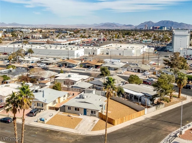 birds eye view of property with a mountain view