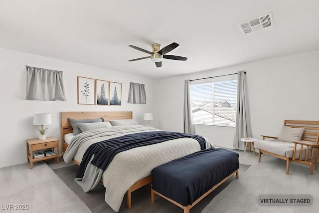 bedroom with visible vents and a ceiling fan