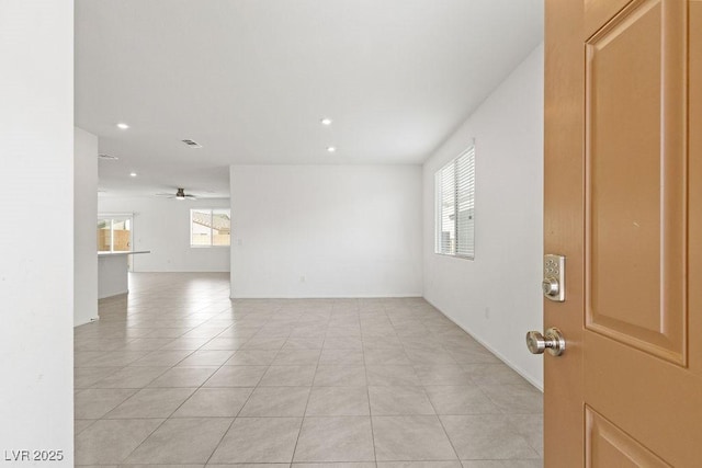 unfurnished room featuring ceiling fan, light tile patterned floors, a wealth of natural light, and recessed lighting