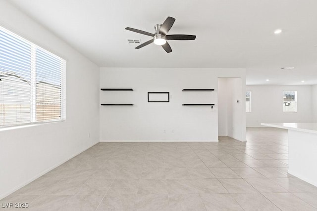 empty room featuring visible vents, light tile patterned flooring, a ceiling fan, and recessed lighting