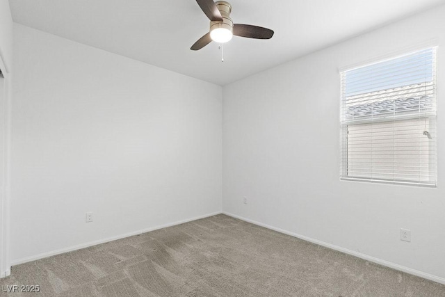 unfurnished room featuring light carpet, ceiling fan, and baseboards