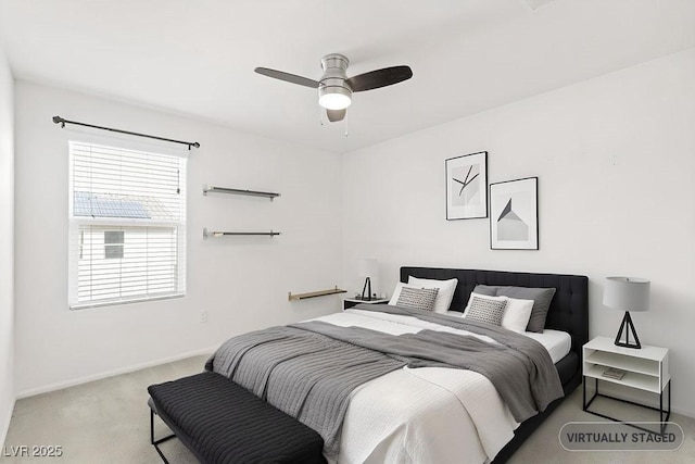 bedroom featuring carpet floors, a ceiling fan, and baseboards