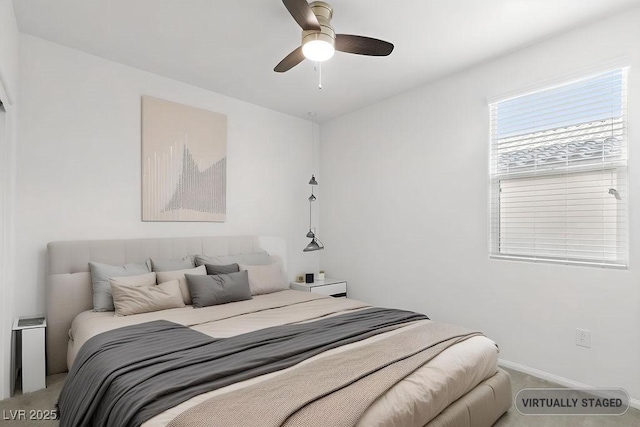 carpeted bedroom featuring a ceiling fan and baseboards