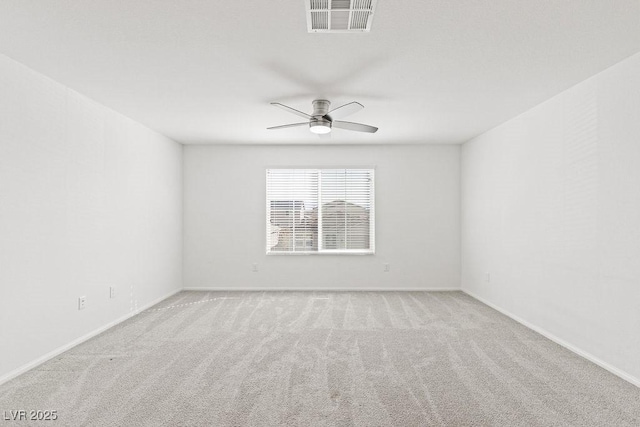 unfurnished room featuring carpet, visible vents, ceiling fan, and baseboards