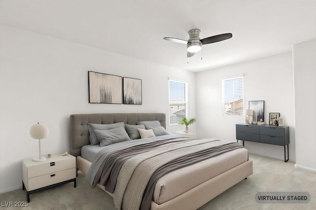 bedroom with baseboards, a ceiling fan, and light colored carpet