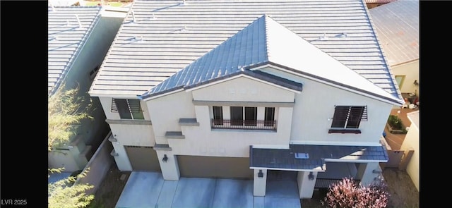 view of front of home with a garage and metal roof