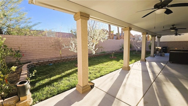 view of patio / terrace with a fenced backyard and a ceiling fan