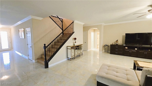 living room with baseboards, arched walkways, stairway, marble finish floor, and crown molding