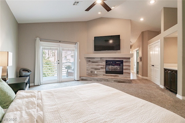 carpeted bedroom with recessed lighting, a fireplace, visible vents, vaulted ceiling, and access to outside