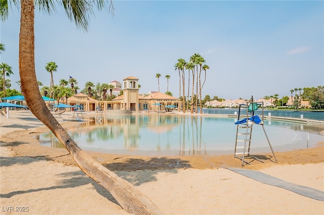 view of pool featuring a water view