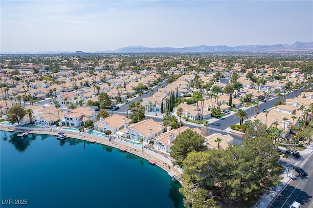 aerial view featuring a water and mountain view and a residential view