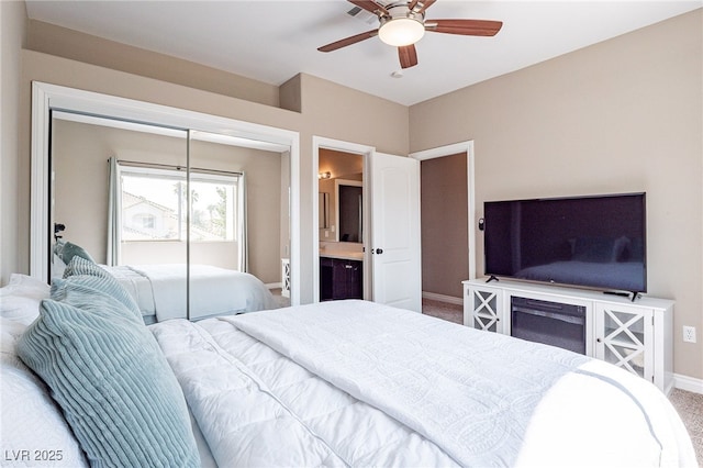 bedroom with a ceiling fan, carpet, baseboards, and a closet