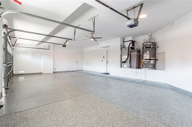 garage with a garage door opener, strapped water heater, and baseboards