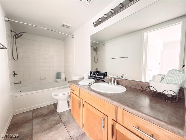 bathroom featuring bathing tub / shower combination, visible vents, toilet, vanity, and tile patterned flooring