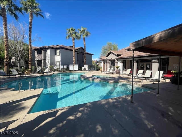 pool featuring a patio and fence