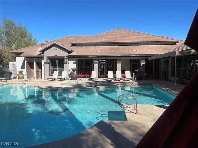 view of pool with a patio area, fence, and a fenced in pool