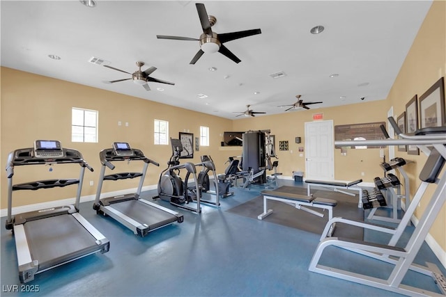 exercise room with visible vents and baseboards