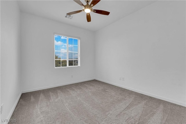 spare room featuring a ceiling fan, carpet, visible vents, and baseboards