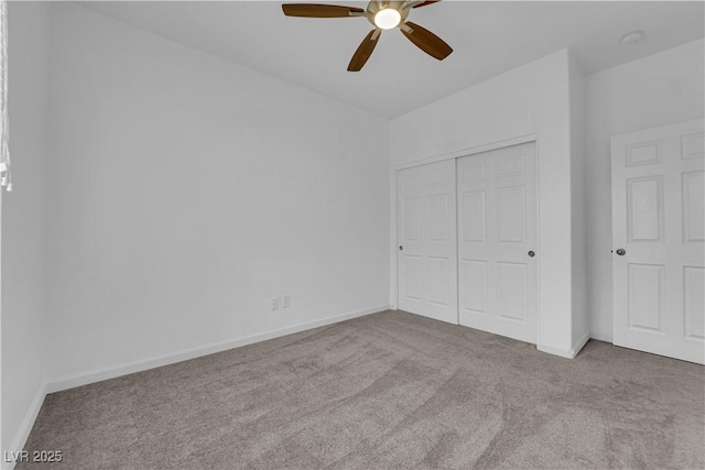 unfurnished bedroom featuring a closet, carpet, and baseboards