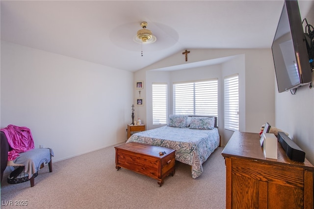 bedroom with lofted ceiling, carpet, a ceiling fan, and baseboards