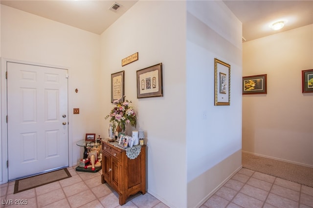 entrance foyer with visible vents, baseboards, and light tile patterned floors