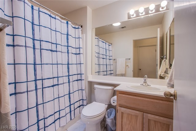 bathroom featuring toilet, visible vents, a shower with shower curtain, and vanity