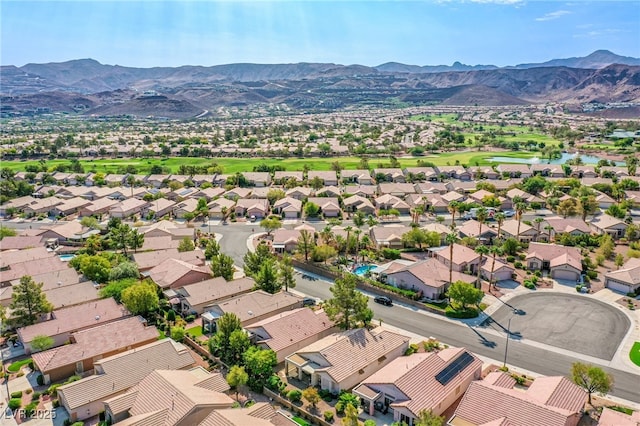 drone / aerial view with a residential view and a mountain view