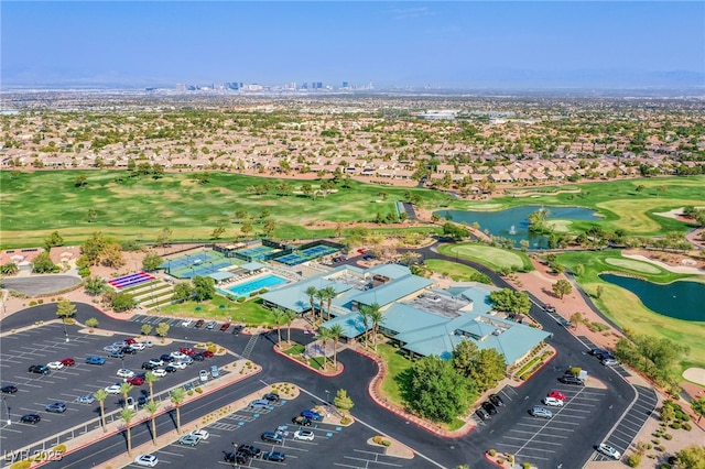 aerial view with a water view and golf course view