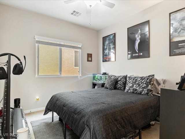 bedroom featuring ceiling fan, carpet flooring, visible vents, and baseboards