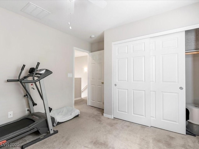 workout room featuring visible vents and carpet flooring